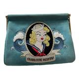 Charlotte Olympia Velvet clutch bag