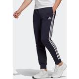 Viskos Byxor adidas Essentials French Terry Tapered Cuff 3Stripes Pants