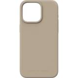 IDeal of Sweden Apple iPhone 15 Sportarmband iDeal of Sweden Silicone Mobilskal MagSafe iPhone 15PM Beige