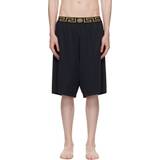 Versace Herr Badbyxor Versace Long surf shorts with Greca trim a80g_black_gold_greek_key