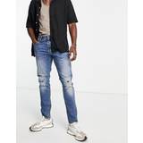 Herr - Skinn Jeans G-Star – 3301 – Mellanljusa, slitna jeans med smal passform-Blå
